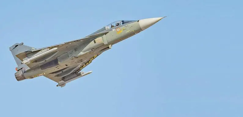Tejas Mk-1A soaring over Himalayas at sunset with IAF insignia